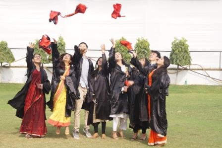 Students of JMI celebrating after receiving their degrees